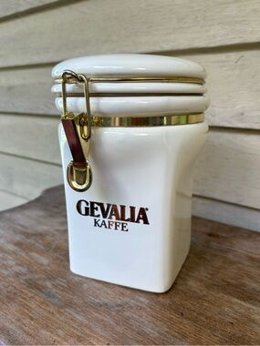 White ceramic Gevalia Kaffe canister features gold-tone hardware
